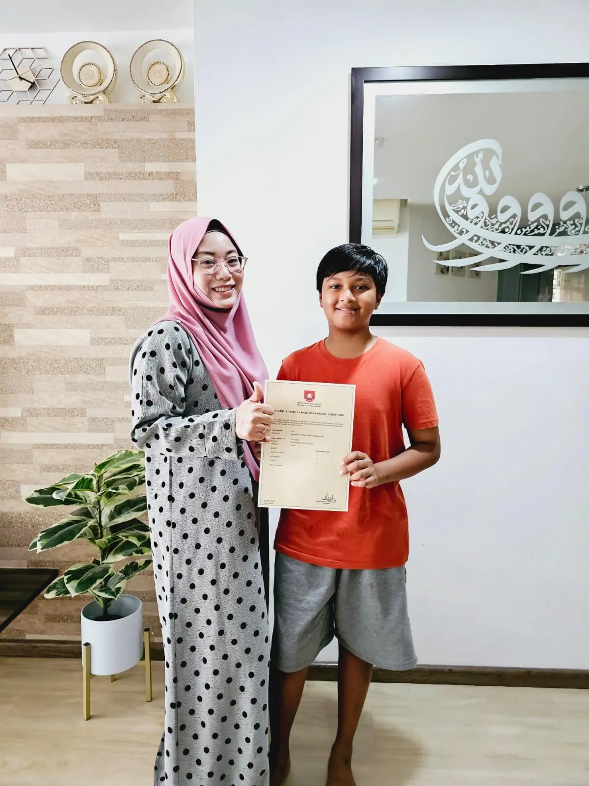 Parent and child celebrating a learning milestone together at home