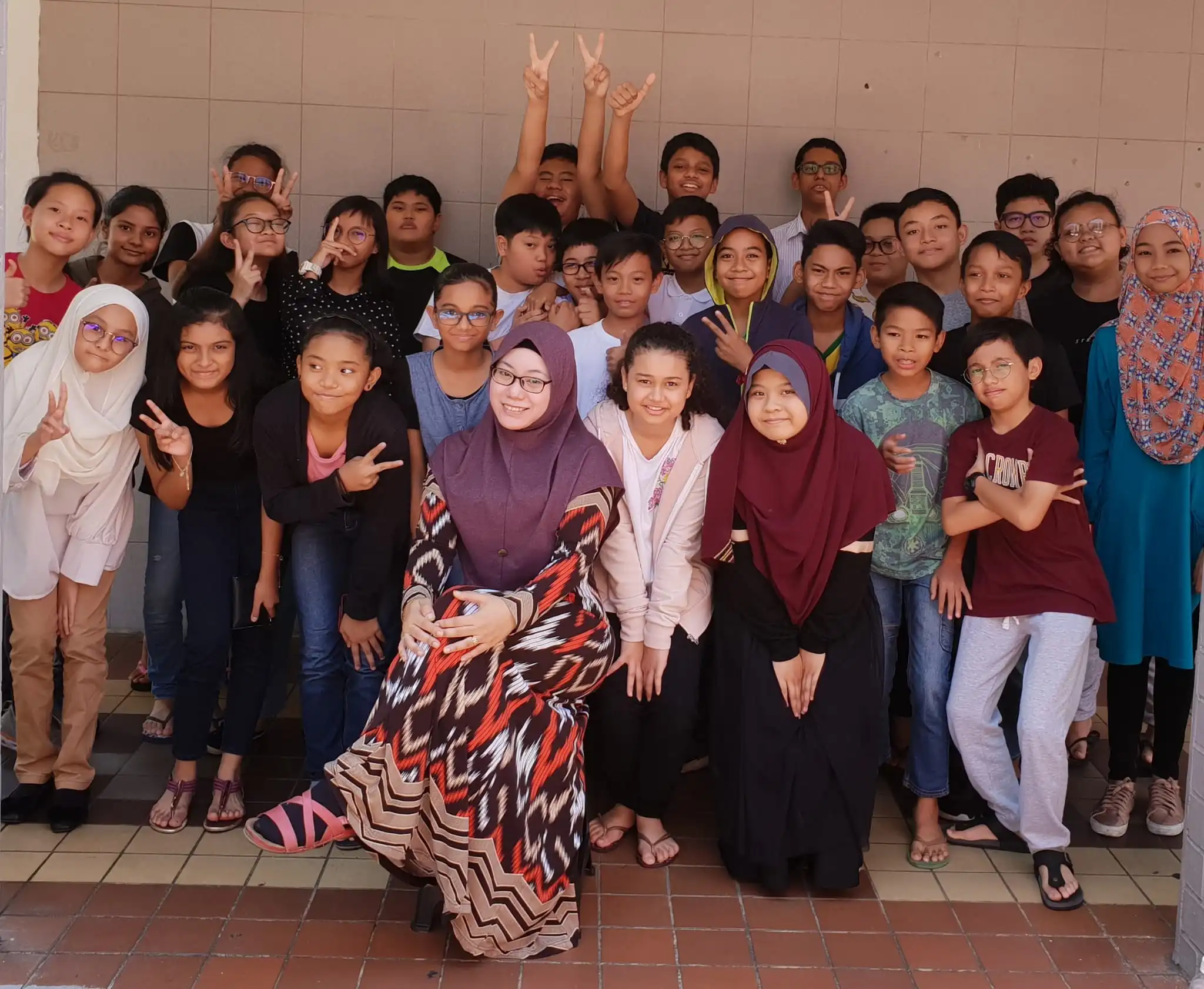School cohort posing together after a learning milestone